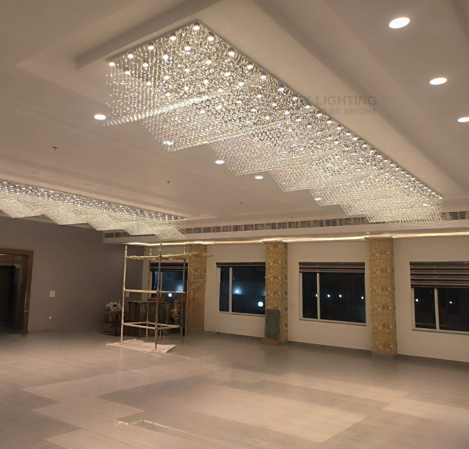 wave shape crystal chandelier made and installed at jind banquet hall